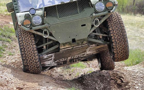 Sgt. Devin L. Cook, of Company D, 1st Battalion, 503rd Regiment, Vicenza, Italy, drives an Army Ground Mobility Vehicle during training at La Comina Italian army base in Pordenone, a few miles south of Aviano Air Base, April 15, 2021. The vehicle is designed to move infantry squads quickly around the battlefield.  

