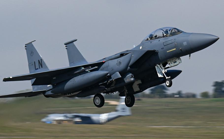 An F-15E Strike Eagle assigned to the 492nd Fighter Squadron takes off from RAF Lakenheath, England, April 19, 2021, for Poland, where U.S. airmen and aircraft are taking part in an agile combat employment exercise with the Polish air force. 
