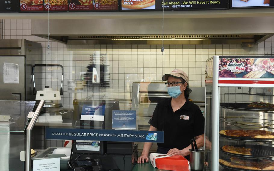 Gaby Zischke, a longtime worker at Anthony's Pizza, waits for customers on Wednesday, April 21, 2021, at Ramstein Air Base, Germany. The Ramstein location, the last in Europe, is closing at the end of the month.
