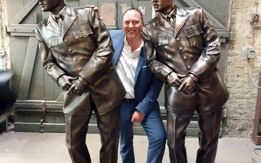 Bad Nauheim, Germany, Mayor Klaus Kress stands with the 3D model and the bronze statue of a leaning Elvis Presley that is going to be placed on a city bridge, mimicking a photo from the time the King was living there in the late 1950s.



