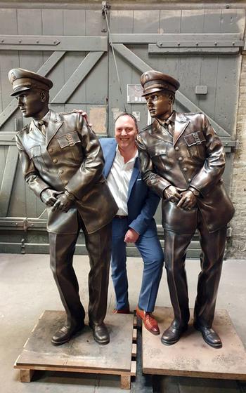 Bad Nauheim, Germany, Mayor Klaus Kress stands with the 3D model and the bronze statue of a leaning Elvis Presley that is going to be placed on a city bridge, mimicking a photo from the time the King was living there in the late 1950s.



