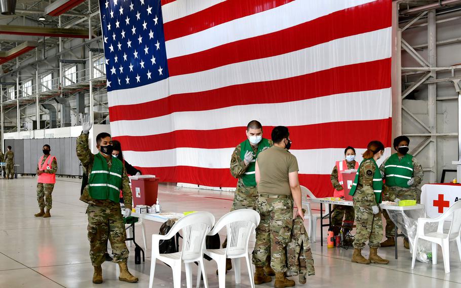 U.S. airmen assigned to the 31st Medical Group give COVID-19 vaccinations at Aviano Air Base, Italy, April 23, 2021.

