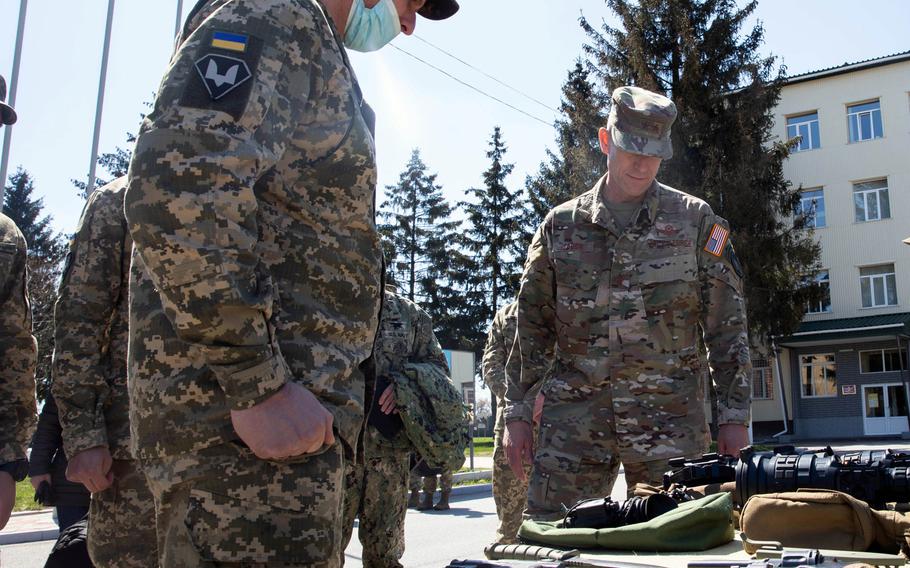 Maj. Gen. David Tabor, right, commander of  U.S. Special Operations Command Europe, receives a weapons briefing at the 142nd Training Center near Kyiv, Ukraine, April 28, 2021. Service members who train at the facility are familiarized with all weapons systems that they may encounter in the region.