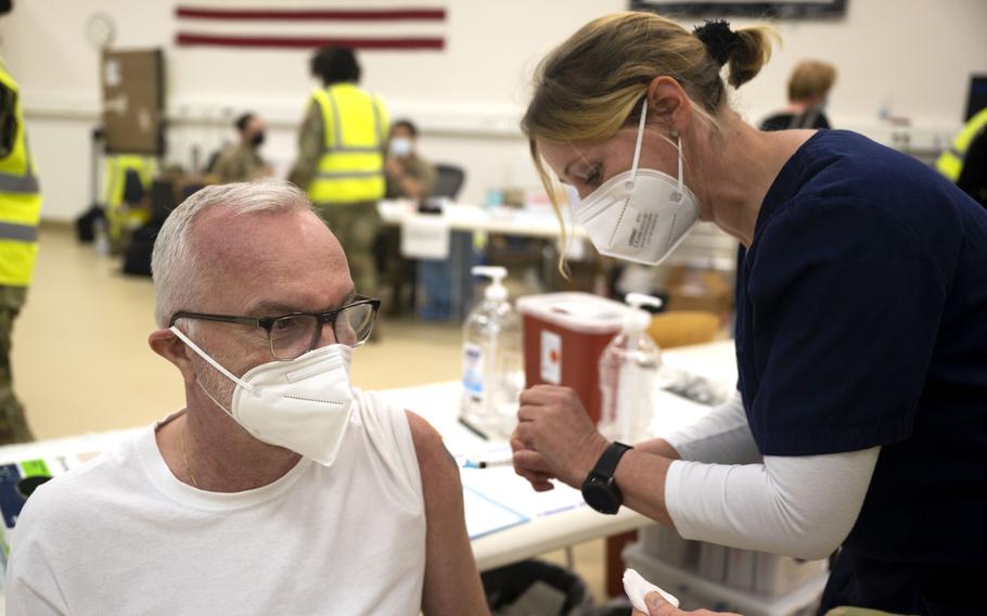 Andreas Heinze, 721st Aerial Port Squadron motor carrier safety specialist, receives a COVID-19 vaccine shot from Iris Geist, a German nurse, at Ramstein Air Base, Germany, April 29, 2021. Ramstein is the first U.S. air base in Europe to vaccinate its local national workforce.