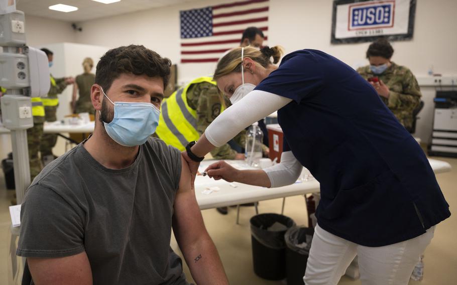 Benny Klein, 86th Civil Engineer Group accounting technician, receives a COVID-19 vaccine shot from German nurse Iris Geist at Ramstein Air Base, Germany, April 29, 2021. Ramstein is the first U.S. air base in Europe to vaccinate its local national workforce.