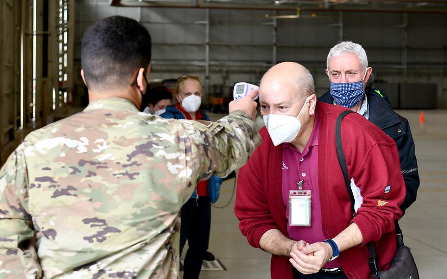 Dennis Basso-Luca, 31st Civil Engineer Squadron service contracts surveillance technician, has his temperature taken before receiving  the Moderna COVID-19 vaccine at Aviano Air Base, Italy, April 30, 2021. The base opened vaccinations to local national employees aged 60 and older on April 30, 2021. 





