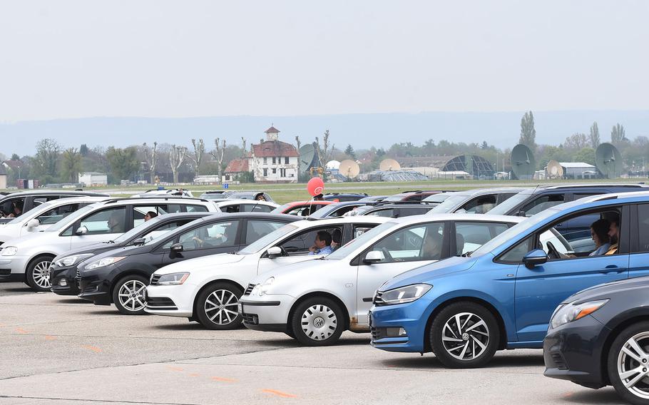 Cars of graduates and their families lined the airfield on Clay Kaserne in Wiesbaden, Germany, for the class of 2021 University of Maryland Global Campus Europe commencement ceremony on Saturday, May 1, 2021.
