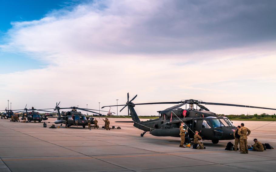 Helicopter crews from the 12th Combat Aviation Brigade unload their Black Hawks after arriving at Bezmer Airfield, Bulgaria on Apr. 30, 2021, for Exercise Swift Response, part of Defender-Europe 21. 





