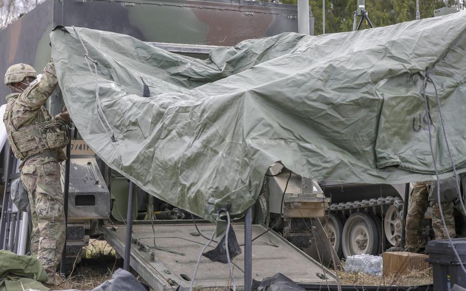 U.S. Army Sgt. Casey Hill, a fires control specialist with Bravo Battery, 1st Battalion, 77th Field Artillery Regiment, 41st Field Artillery Brigade, sets up a tent on the Tapa Central Training Area, Estonia, in preparation for the kickoff of ''Fires Shock,'' an exercise in support of Defender-Europe 21, May 2, 2021. 
