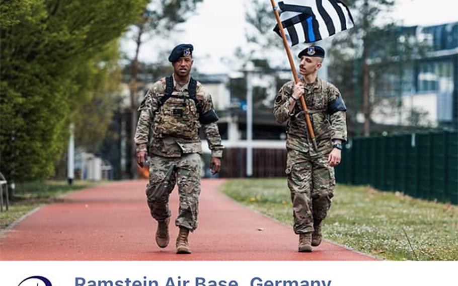 A screenshot of a photo on Ramstein Air Base’s Facebook page Tuesday shows a security forces airman carrying a black-and-white American flag with a blue line through it. The photo was posted to show support for the airmen during National Police Week. It was taken down after the base said it violated a Pentagon policy on what types of flags may be displayed on U.S. military installations.

