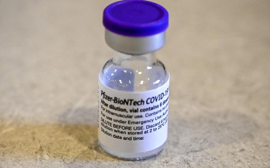 A vial of Pfizer COVID-19 vaccine sits on a table during a vaccination clinic at Bradley Air National Guard Base in Connecticut, April 18, 2021. Several U.S. bases in Europe are planning to offer the vaccine to children ages 12 to 17 starting next week as the vaccine is expected to arrive in theater early next week. 

