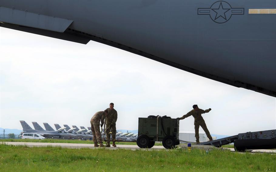 A U.S. Air Force C-17 Globemaster III delivers support equipment to Campia Turzii, Romania, in 2019. The Air Force has plans to spend $152 million on upgrades to the base, including a ''dangerous cargo pad'' to support aircraft with up to 30,000 pounds in explosives. 

