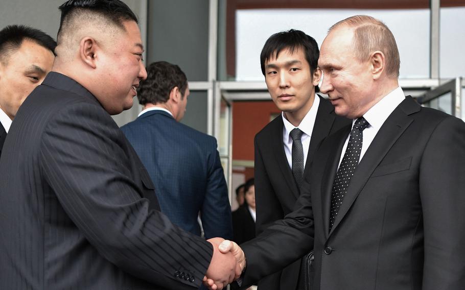 Russian President Vladimir Putin, right, sees North Korean leader Kim Jong Un off following their talks at the Far Eastern Federal University campus on Russky island in the far-eastern Russian port of Vladivostok on April 25, 2019. 