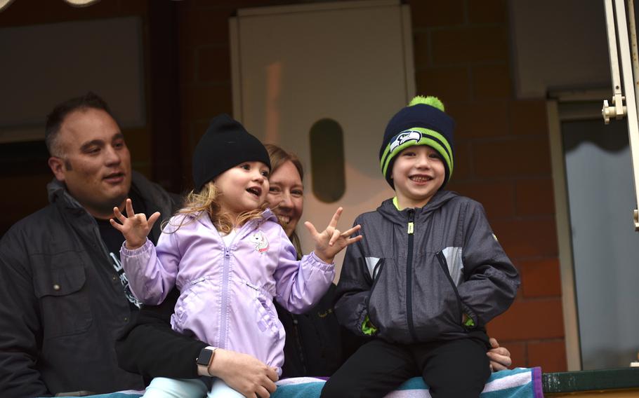 Lucas, Emelia, Tiffany and Landon Schoenborn (left to right) at the Navy's Naples Support Site take part in Operation Fun/GDT (Get Down Tonight), March 25, 2020. The singalong event is held on Wednesday and Friday evenings during the movement restrictions in place because of the coronavirus. 

