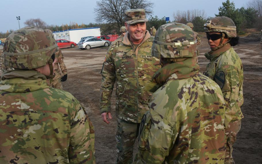 Col. Phil Brooks, 1st Infantry Division forward commander, visits with soldiers during a visit to Torun, Poland, on Nov. 27, 2019.  Brooks and Command Sgt. Maj. Joshua C. Holthus were at Torun to bring some Thanksgiving cheer to the 3rd Battalion, 16th Field Artillery Regiment of the 2nd Armored Brigade Combat Team.