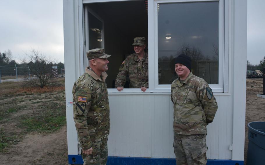Col. Phil Brooks, 1st Infantry Division forward commander, visits with soldiers during a Thanksgiving visit to Torun, Poland, on Nov. 27, 2019.  Brooks and Command Sgt. Maj. Joshua C. Holthus, 1st Infantry Division Forward Command Sgt. Major, wanted to bring a little Thanksgiving cheer to the deployed soldiers.