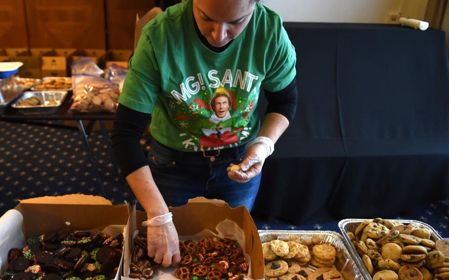 Diana Stuart, an Air Force spouse at Ramstein Air Base, Germany, sorts through a box of cookies made with pretzels and candy Thursday, Dec. 12, 2019. Thousands of cookies were donated for the annual holiday cookie drive, organized by the Ramstein Officers Spouses Club, for single and unaccompanied service members.

