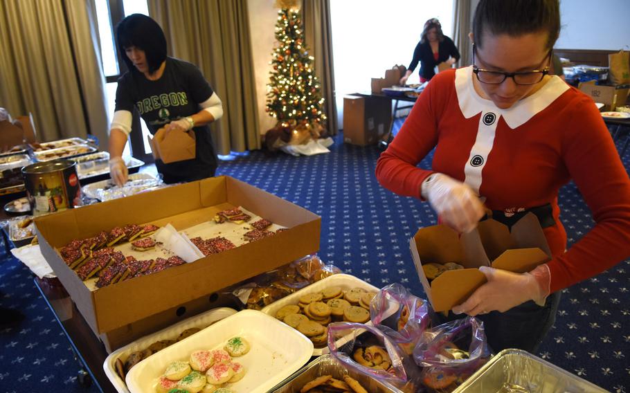Elizabeth Chambers, an Air Force spouse at Ramstein Air Base, Germany, boxes cookies on Thursday, Dec. 12, 2019, for the annual holiday cookie drive at Ramstein Air Base, Germany.



