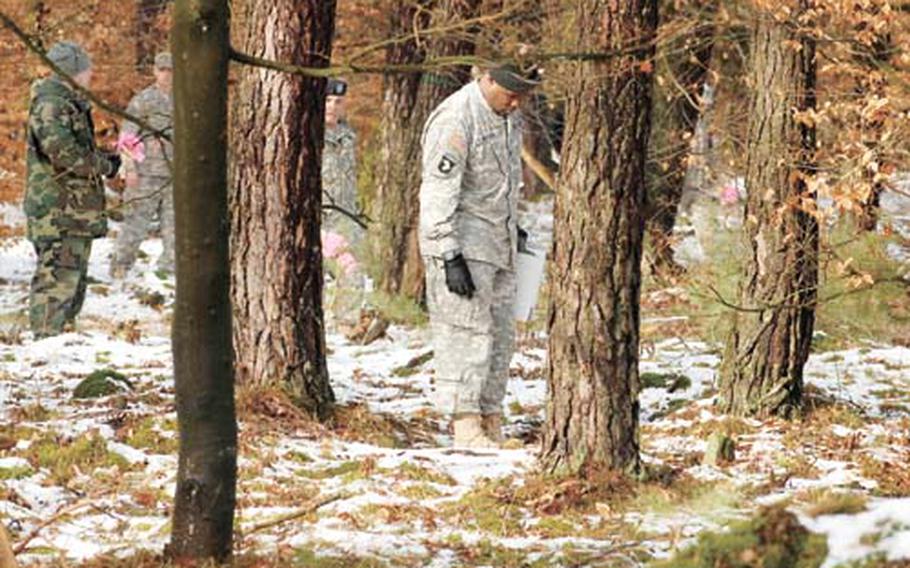 In this February photo, soldiers search the site where a U.S. Army Black Hawk helicopter crashed. The helicopter was on its way to Coleman Army Air Field in Mannheim when it went down in a thick patch of woods. Three soldiers were killed in the crash.