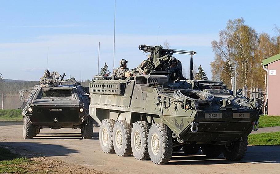 A Stryker armored vehicle from U.S. 3rd Squadron, 2nd Stryker Cavalry Regiment, right, rolls into action alongside a vehicle from the Germany army's 104th Panzer Battalion during a recent training exercise Grafenwöhr, Germany. The Strykers have been dropped from the operation in the city of Kandahar this summer and reassigned to nearby Zabul province.