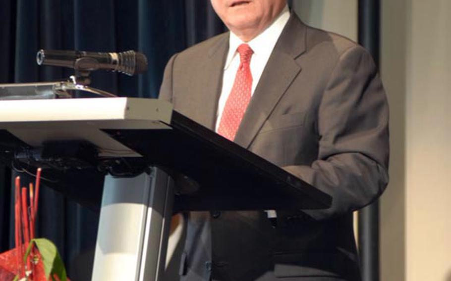 Defense Secretary Robert Gates speaks to a crowd of 124 graduates of Kaiserslautern High School at their graduation ceremony held in the German city&#39;s Fruchthalle building, June 11.