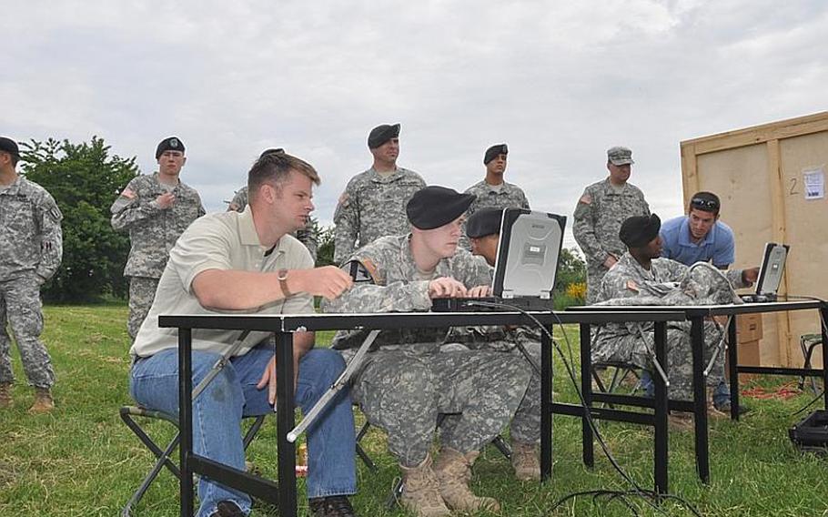 Soldiers from the 170th Infantry Brigade Combat are taught how to use software with the Counterbomber, a radar system that can detect suicide vests and other weapons under people&#39;s clothing. Baumholder-based soldiers are the first Army unit to be trained on the device.