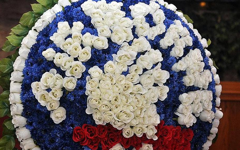 A floral representation of the 173rd Airborne Brigade Combat Team&#39;s patch was used in a ceremony Tuesday at Caserma Ederle in Vicenza, Italy, to remember three fallen Sky Soldiers.