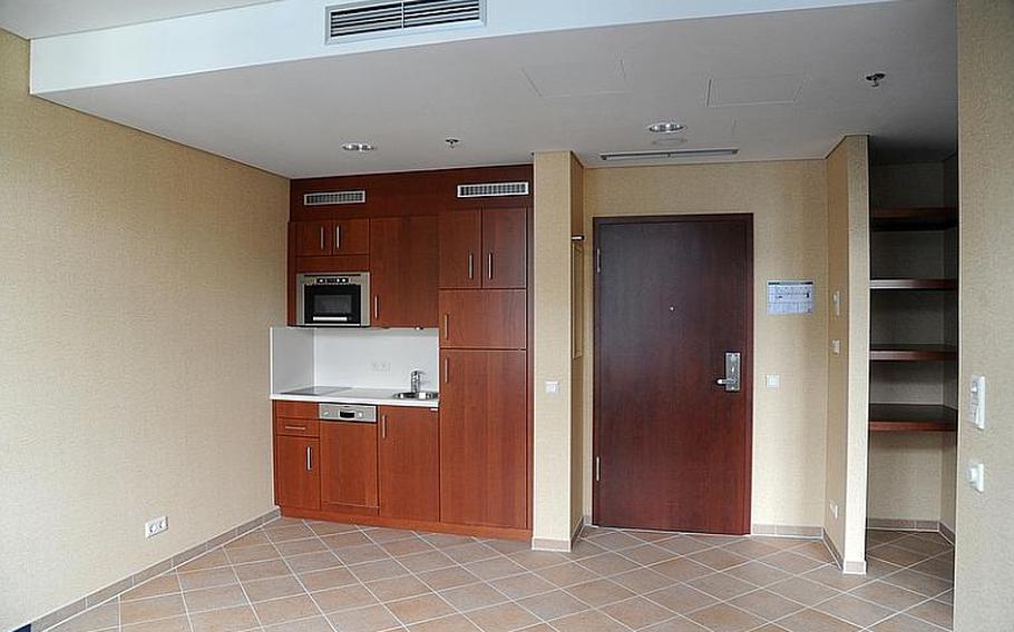The kitchenette and entrance of one of the extended stay  rooms at the Wiesbaden Army Lodge. The 164-room hotel on Hainerberg housing area was due to open last September, but a water leak and other problems have delayed its opening.