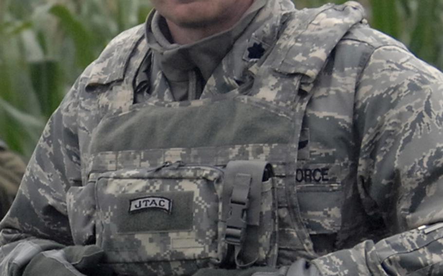 U.S. Air Force Lt. Col. Al Roberts, commander of the U.S. Air Forces in Europe&#39;s Air Ground Operations School, watches a joint terminal attack controller course&#39;s field training exercise near Bann, Germany, on Sept. 28.