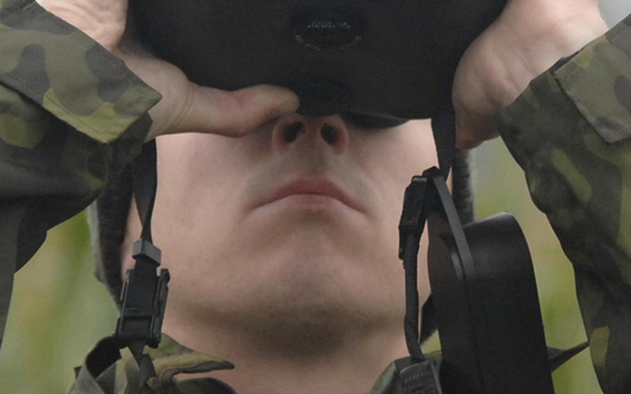 Estonian air force Sgt. Tonis V?lim?e calibrates the distance on a laser range finder binoculars before plotting coordinates for an airstrike during a joint terminal attack controller course field exercise near Bann, Germany, on Sept. 28.