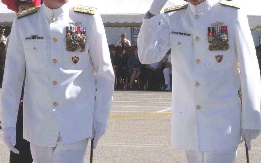Outgoing commander Adm. Mark Fitzgerald, left, and incoming commander Adm. Samuel J. Locklear, III, review the troops at a change of command ceremony in Naples on Wednesday morning.
