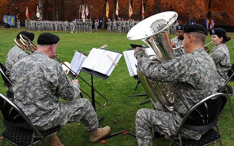 The U.S. Army Europe Band & Chorus' brass quintet provided the music at the 21st Theater Support Command's fallen soldier retreat at Panzer Kaserne in Kaiserslautern, Germany, on Thursday. Plaques honoring Staff Sgts. James Ide and Derek Farley and Sgt. Anton Phillips were added to the 21st TSC memorial.