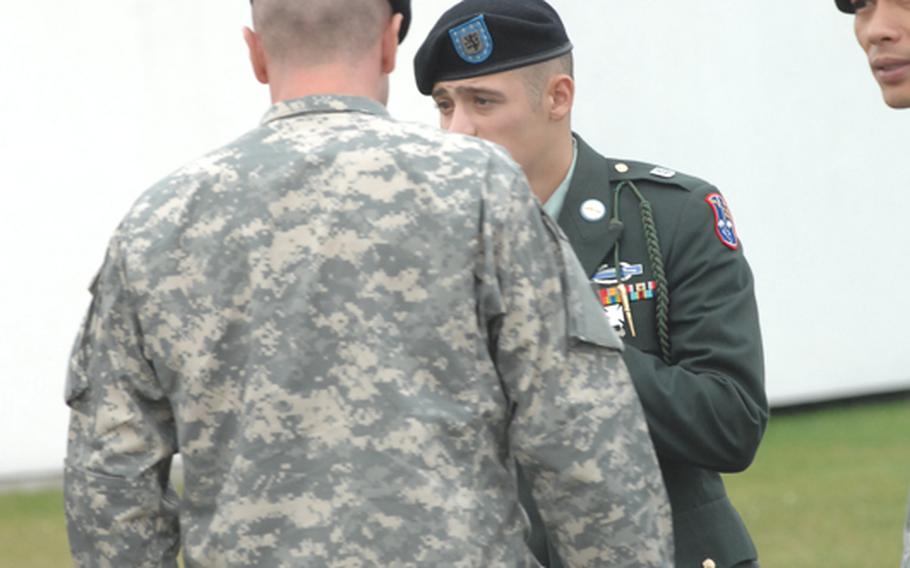 Pvt. Roy Buhrow, facing camera, will serve more than two years in prison after he was found guilty at a court- martial in Vilseck on Tuesday of throwing a crowbar that struck a German motorcyclist in the head.