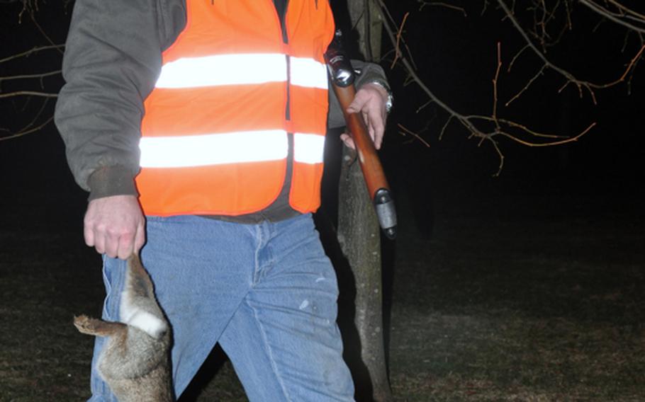 Chris Wachtendorf, from Russellville, Ark., carries a rabbit he killed Monday at Heidelberg, Germany's Patrick Henry Village.