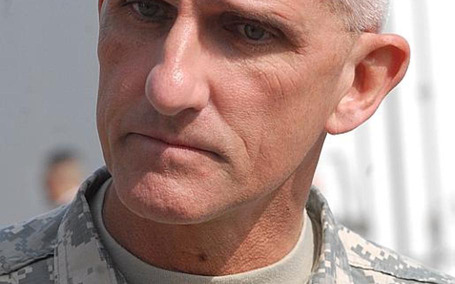 Lt. Gen. Mark P. Hertling, U.S. Army Europe's new commander, answers questions from members of the press after assuming command of the unit Friday at Heidelberg's Campbell Barracks.