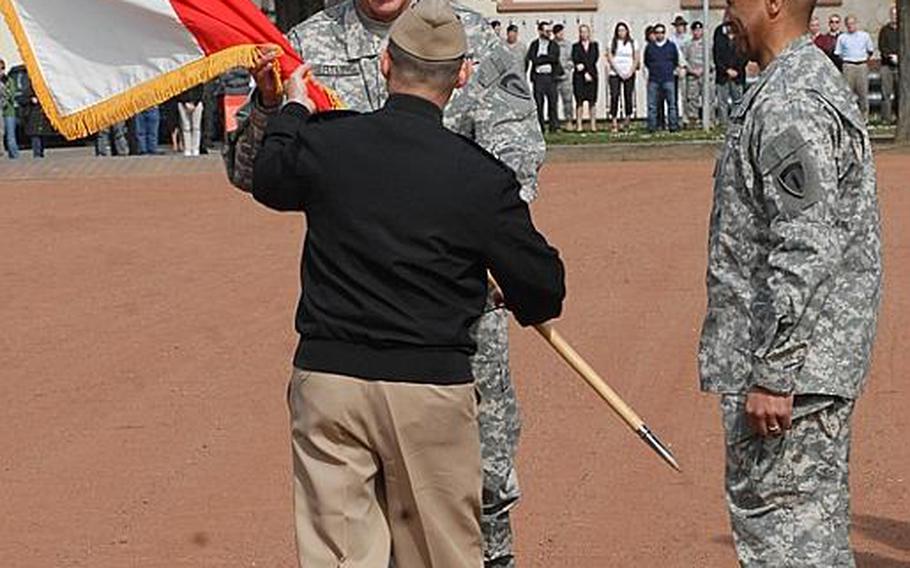 Lt. Gen. Mark P. Hertling takes the colors from Adm. James Stavridis, commander of U.S. European Command, during a Friday ceremony in which Hertling became the new U.S. Army Europe commander. The ceremony was held at Campbell Barracks in Heidelberg, Germany.