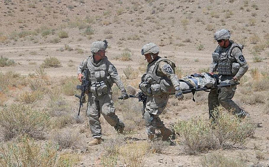 Soldiers from 4th Battalion, 23rd Infantry Regiment, 5th Stryker Brigade Combat Team carry a wounded soldier to be medically evacuated after his vehicle hit an anti-tank mine in Zabul Province, Afghanistan. Seventeen Stryker soldiers have died since the unit deployed to Afghanistan in July. The DOD announced this week that the Vilseck-Germany based 2nd Stryker Cavalry Regiment will replaced the 5th Strykers in Afghanistan next summer.