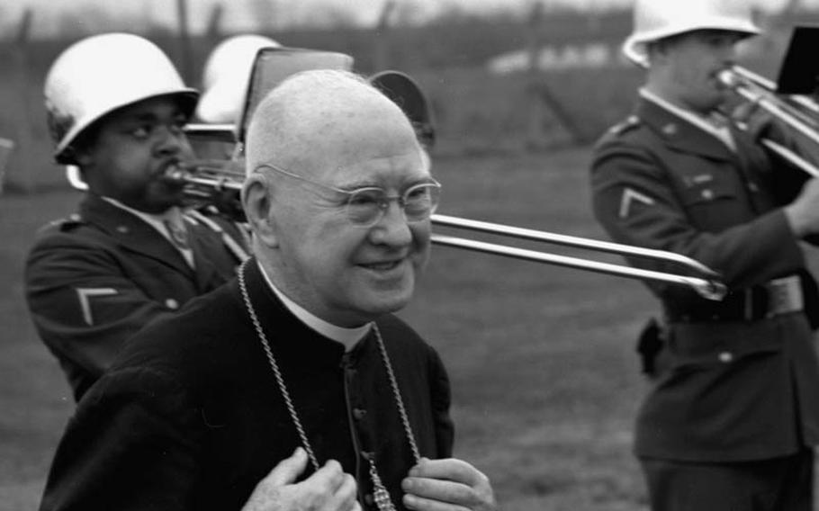 Mannheim, Germany, December 19, 1966: Francis Cardinal Spellman, U.S. Military Vicar and Archbishop of New York, is serenaded by the 8th Division band during his visit to the 2nd Battalion, 13th Infantry at Mannheim, Germany, in December, 1966. On trombone at left is Pfc. Carlos Miles.