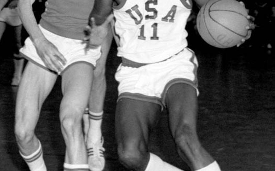 Michigan prep standout Earvin "Magic" Johnson moves toward the basket during the U.S. team&#39;s 118-65 win over Spain in the first round of the annual Albert Schweitzer basketball tournament in April, 1977. The future NBA great averaged a team-high 20 points per game as the Americans swept to their third straight tourney title.