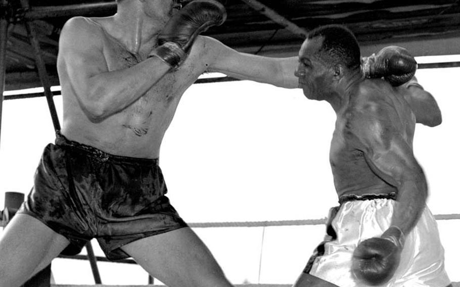 Servicemembers stationed at Mannheim, Germany, in May, 1950 had a chance to see some big-time boxing as Jersey Joe Walcott, right, continued his quest for a shot at the world heavyweight boxing championship against German champion Hein Ten Hoff before a rain-soaked crowd of 30,000 at Mannheim Stadium. Walcott, 36, spotted his opponent five inches in height and 20 pounds, but won a 10-round decision. The following year, he became the oldest man ever to win the title by knocking out Ezzard Charles.