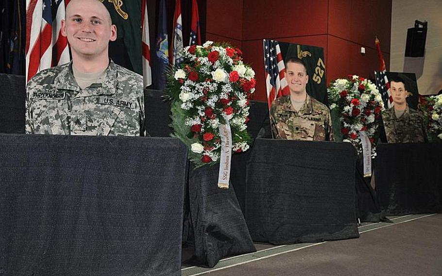 From left, photos of Staff Sgt. Joshua A. Throckmorton, 28, of Battle Creek, Mich.; Spc. Jordan C. Schumann, 24, of Port St. Lucie, Fla.; and Spc. Preston J. Suter, 22, of Sandy, Utah, are displayed at a memorial service Wednesday in Hohenfels, Germany. The soldiers were killed July 5 by a bomb in Afghanistan, according to a Defense Department news release. They were assigned to the 527th Military Police Company, 709th Military Police Battalion, 18th Military Police Brigade.