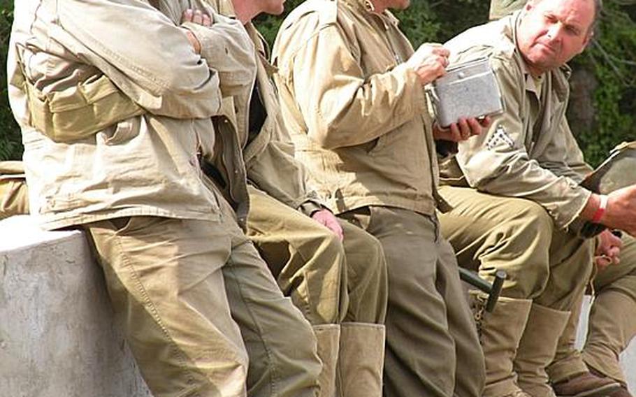 World War II re-enactors enjoy a break at the 29th annual War and Peace show July 22 at Paddock Wood, south of London. Many of the re-enactor groups at the event try to be as authentic as possible. 
