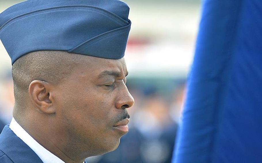 Chief Master Sgt. Zef Smith, command chief of the 86th Airlift Wing, shuts his eyes during a prayer. The prayer was part of a ceremony, held at Ramstein Air Base Friday, which commemorated the10th anniversary of the attacks on Sept. 11.