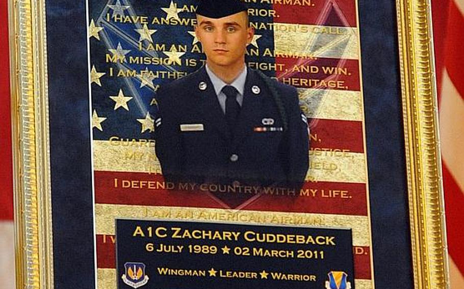 A photo of Airman 1st Class Zachary Cuddeback on display at his memorial service at Ramstein Air Base, Germany, on Mar. 10, 2011. Cuddeback was one of two airmen killed by a gunman at Frankfurt airport on March 2.