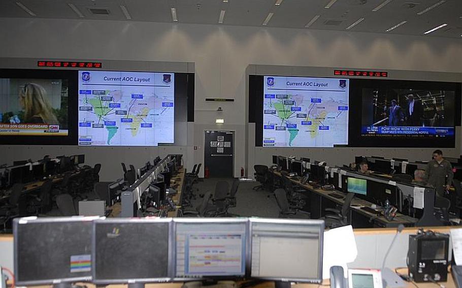 The combat operations division in the 603rd Air and Space Operations Center at Ramstein Air Base, Germany, features a state-of-the art data wall (background) that can be tailored to provide information from up to 48  individual displays. During the campaign in Libya, for example, these screens could show the location of friendly forces.