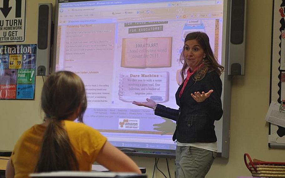 Angela Wilson, a seventh-grade language arts teacher at Vicenza Middle School, asks students a question Thursday during a study session. The 37-year-old was named the 2012 Teacher of the Year for the Department of Defense Education Activity. 