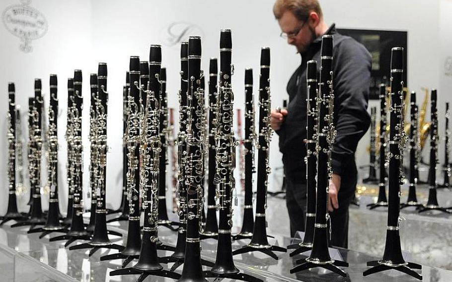 One visitor to the Musikmesse international music fair in Frankfurt, Germany, seems surrounded by a forest of clarinets as he contemplates which one to try. With about 1,500 exhibitors, the fair is advertised as the largest of its kind in the world.