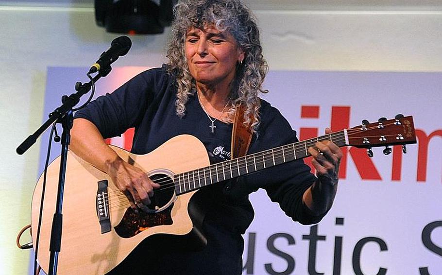 American folk and blues singer Diane Ponzio performs at the Musikmesse in Frankfurt, Germany. The international music fair opens its doors to the general public at Frankfurt's fairgrounds (Messe) on March 24, 2012. Concerts are held throughout the day in the exhibition area. Admission is 20 euros, and tickets can be bought online.