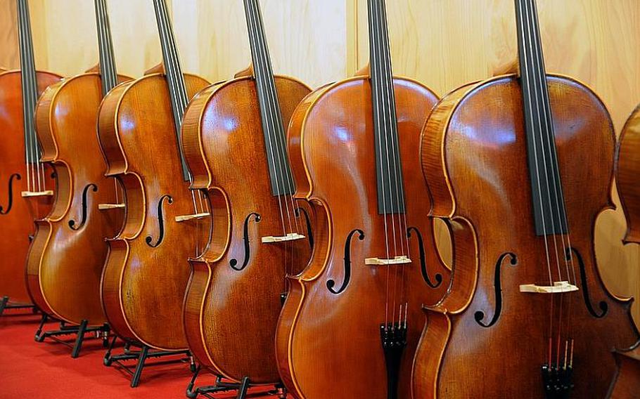 A selection of cellos sits on display at the Musikmesse. About 1,500 exhibitors are on hand at the music fair, which features everything from traditional musical instruments to modern digital electronics.