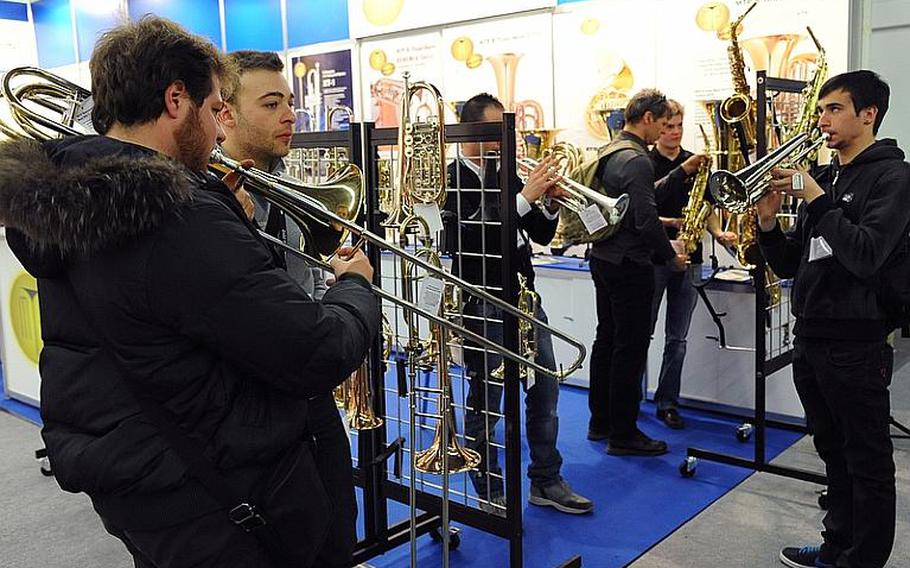 Visitors to the Musikmesse, the international music fair in Frankfurt, Germany, test a variety of brass instruments. Admission to the fair, which opens to the public March 24, 2012, is 20 euros, and tickets can be bought online.